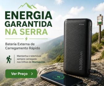 Bateria externa portátil preta sobre uma rocha a carregar um telemóvel num miradouro com vista para a serra.